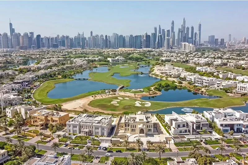 Dubai skyline with Burj Khalifa and marina highlighting prime locations for Dubai Golden Visa through property investment.